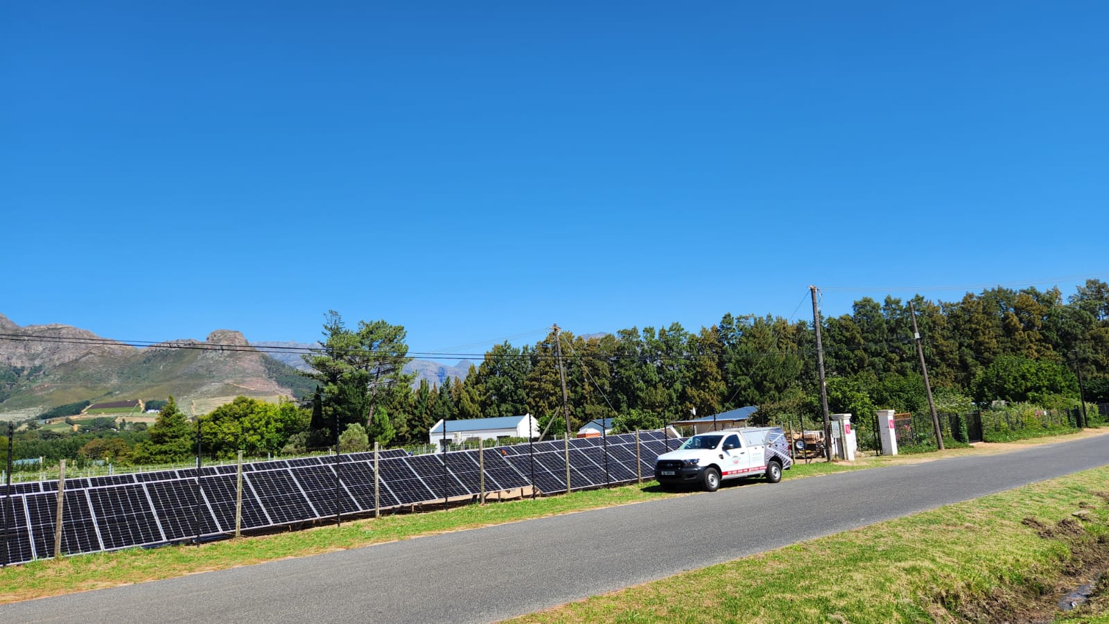 Winelands Solar installation at a Cape Winelands vineyard with mountains in the background